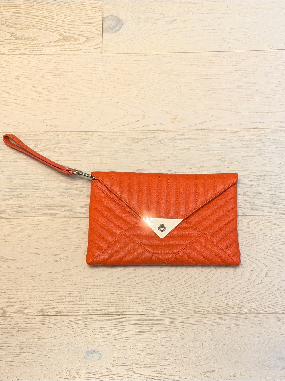 L.A.M.B. Orange Quilted Wristlet Clutch with Gold Triangle Lock